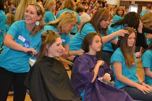 MjjM Salons stylists at the Greely High School Beautiful Lengths ponytail-cutting event